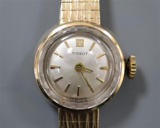 A ladys 1960s 9ct gold Tissot wristwatch on integral tapered bracelet, total 15.9g.